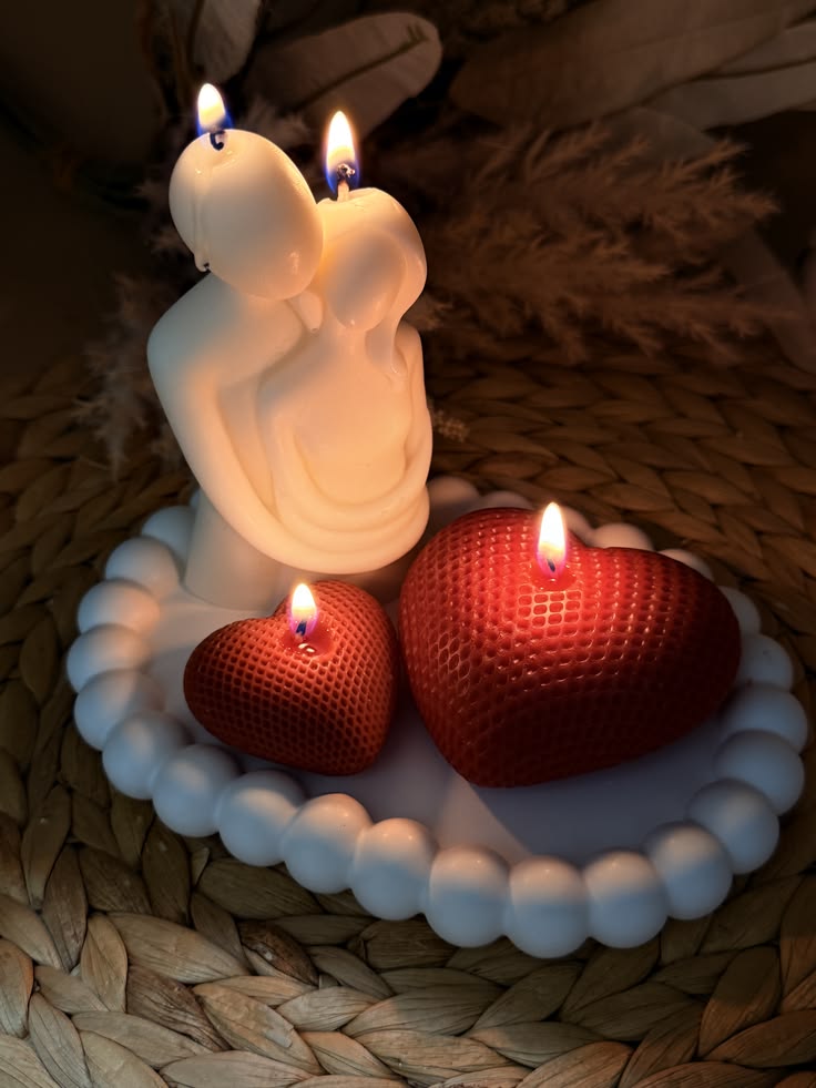 Cream bear-shaped candle beside an ivory speckled fluted candle vessel, photo 3