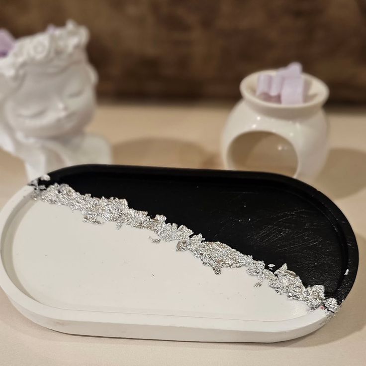 Ivory oval tray with brown abstract splatter pattern beside a plain brown tray, photo 3